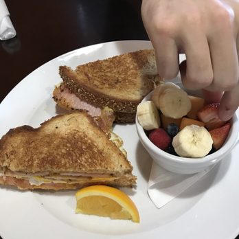 Two Brothers Kitchen - Peameal egg sandwich with side fruit and my boyfriends hand. - Breakfast & Brunch Near Me - Anthem, Arizona
