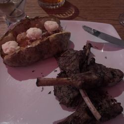 Uptown Bar and Restaurant - Lamb chops with a loaded baked potato and side salad