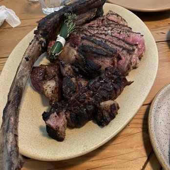 Campfire - Medium rare 58oz tomahawk. Exquisite - New American Near Me - Carlsbad, California Campfire - Medium rare 58oz tomahawk. Exquisite - New American Near Me - Carlsbad, California
