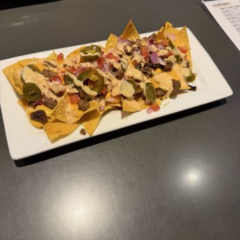 Jimmy E’s Bar + Grill - Happy hour nachos - American Near Me - Signal Hill, California Jimmy E’s Bar + Grill - Happy hour nachos - American Near Me - Signal Hill, California