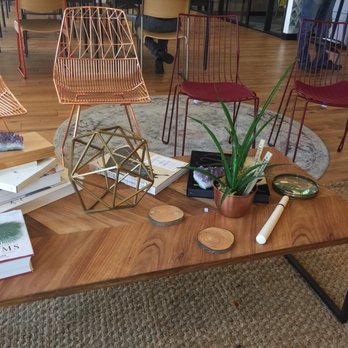 WeWork - Opposite of the is a thoughtfully curated coffee table nook area not quite as comfy as couch but good alternative - Shared Office Spaces Near Me - Pasadena, California