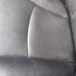 Dirt and crumbs in seems of most of the seat. Guess $200 doesn't get you much.