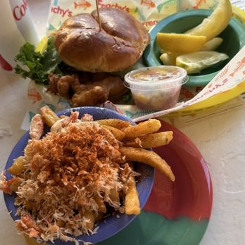 Frenchys Outpost Bar & Grill - Frenchy's Garlic Crab Fries** Original Grouper Sandwich 4 inch - Bars Near Me - Dunedin, Florida