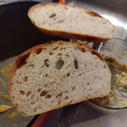 Blue Heron Bakery - This is the Olive and garlic sourdough bread, scooping up homemade butternut squash and garlic hummus..