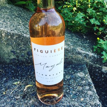 Winot - a bottle of wine sitting on a rock - Beer, Wine & Spirits Near Me - Brooklyn, New York