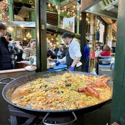 Furness Fish Poultry & Game - Paella! It is huge pan freshly cooking entire market smells so good.