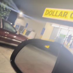 Dollar General - Store is brightly lit & still open. Employee guarding the door. Did not want to capture her face in the photo.