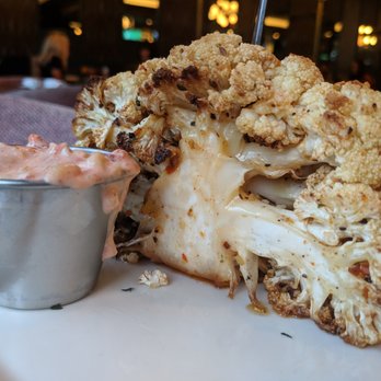 Jim Brady's - Hot, crunchy, roasted cauliflower with romesco sauce. - American Near Me - Royal Oak, Michigan Jim Brady's - Hot, crunchy, roasted cauliflower with romesco sauce. - American Near Me - Royal Oak, Michigan