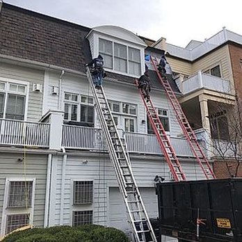 Shiner Exteriors - Workers had to use ladders to put the shingles on the vertical portion of the roof. - Roofing Near Me - Sterling, Virginia Shiner Exteriors - Workers had to use ladders to put the shingles on the vertical portion of the roof. - Roofing Near Me - Sterling, Virginia