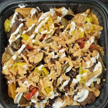 Loaded Elevated Nachos - Philly cheesesteak with sub mushrooms. - New American Near Me - St. Charles, Missouri Loaded Elevated Nachos - Philly cheesesteak with sub mushrooms. - New American Near Me - St. Charles, Missouri
