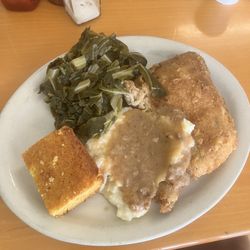 Fried chicken, mashed potatoes, greens, and corn bread.