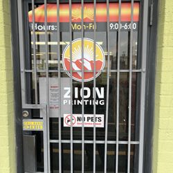 Zion Printing - A locked door with no employees behind it