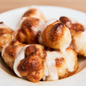 Johnny's New York Style Pizza - CINNAMON KNOTS (WITH ICING) - Our homemade dough knots with butter and sprinkled sugar and cinnamon. Topped with icing. - Italian Near Me - Hickory Flat, Georgia Johnny's New York Style Pizza - CINNAMON KNOTS (WITH ICING) - Our homemade dough knots with butter and sprinkled sugar and cinnamon. Topped with icing. - Italian Near Me - Hickory Flat, Georgia