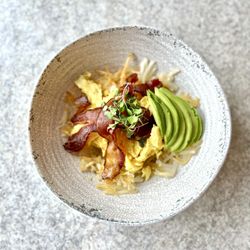 Good Kitchen - Avocado bacon bowl over crispy hash browns with cheese and your choice of eggs