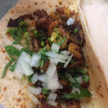Tacos La Bala - Trompo on flour tortilla. The trompo had puedes of pineapple and it makes it taste 100 times better. - Mexican Near Me - Houston, Texas Tacos La Bala - Trompo on flour tortilla. The trompo had puedes of pineapple and it makes it taste 100 times better. - Mexican Near Me - Houston, Texas