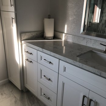 The Cabinet Lady - Replaced angled corner cabinets with new tall line closet. This was a much better use of the space in the bathroom. - General Contractors Near Me