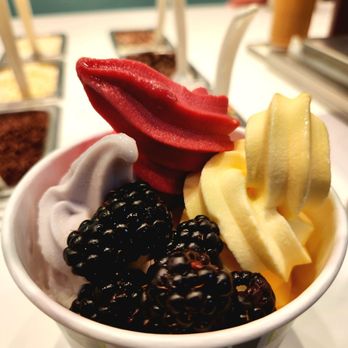 Yogurtini - Dole Pineapple Whip, Blueberry Tartini, and Pomegranate Raspberry Sorbet. Topped with blackberries. - Ice Cream & Frozen Yogurt Near Me - Glendale, Arizona Yogurtini - Dole Pineapple Whip, Blueberry Tartini, and Pomegranate Raspberry Sorbet. Topped with blackberries. - Ice Cream & Frozen Yogurt Near Me - Glendale, Arizona