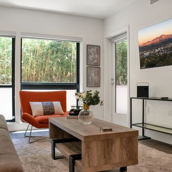 Advanstay - Zen-like garden view Living Room with private patio. All Advanstay apartments feature 4K Roku TVs with YouTube TV subscriptions. - Vacation Rentals Near Me Advanstay - Zen-like garden view Living Room with private patio. All Advanstay apartments feature 4K Roku TVs with YouTube TV subscriptions. - Vacation Rentals Near Me