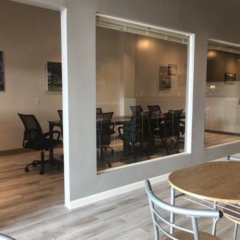 CONCAFE - a conference room with a table and chairs - Coffee & Tea Near Me - Houston, Texas