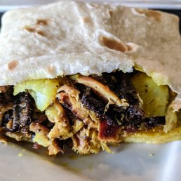 Jerk chicken in roti