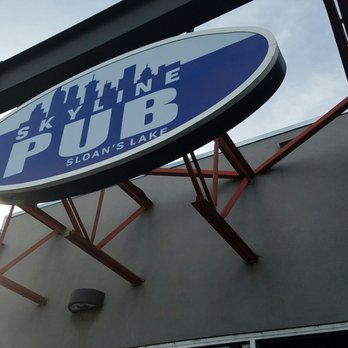 Skyline Pub - a blue and white sign on the side of a building - Sports Bars Near Me - Edgewater, Colorado