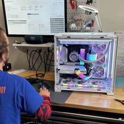 Positive Technology computer repair service, a technician working on a custom build PC. Custom PC building service. Custom PC maintenance.