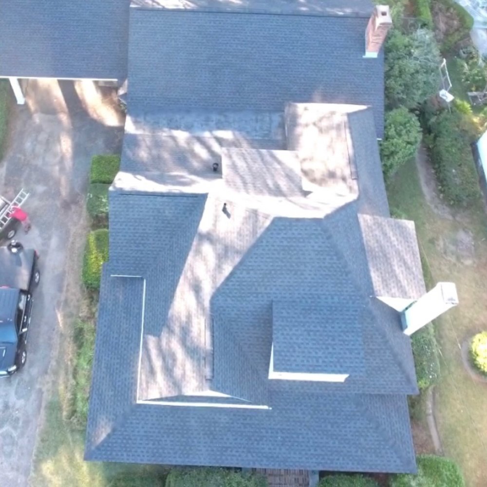 Slide of Akurate Roofing Group