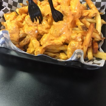 Wingsaholic - This is their famous fries with bonesless chicken wings and mango spice over it.  1 to 5, 5 being the best. 4 - Chicken Wings Near Me - Anaheim, California