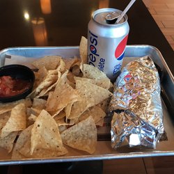 Mucho Burrito Fresh Mexican Grill - Small burrito with chips and salsa.