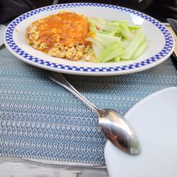 La Hoja Cafe - Chorizo and eggs with manchego cheese and ranchero sauce. Steamed chayote on the side.
