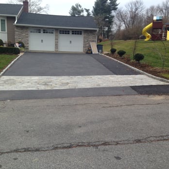 Tri-County Complete Landscaping - a driveway in a residential neighborhood - Tree Services Near Me