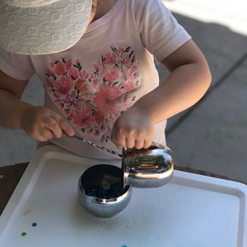 Tree House Daycare - An example of dexterity practice, moving liquids between containers, which is a lot of fun, if you are preparing tea for your friends! - Child Care & Day Care Near Me - Pacheco, California