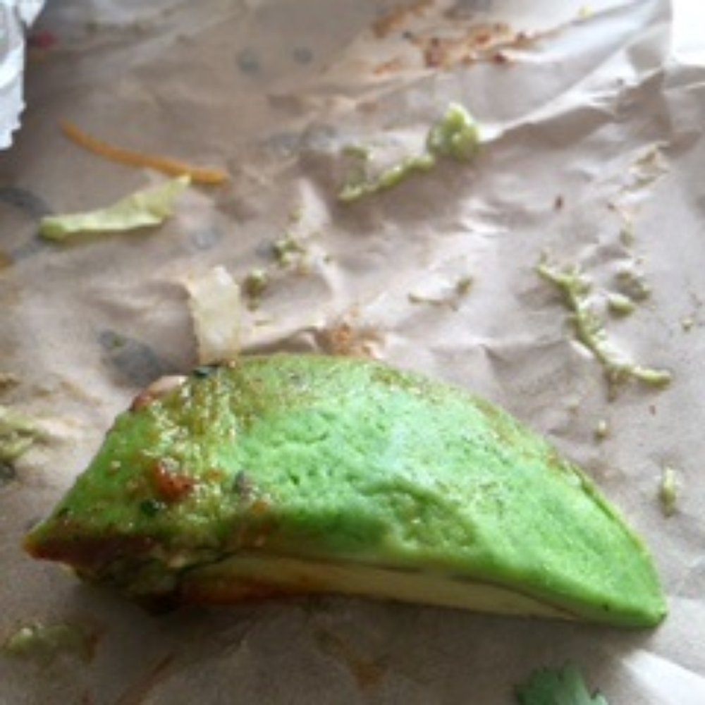 The sad and hard avocado from the street taco. I think it looks more like a lime wedge, than an avocado?