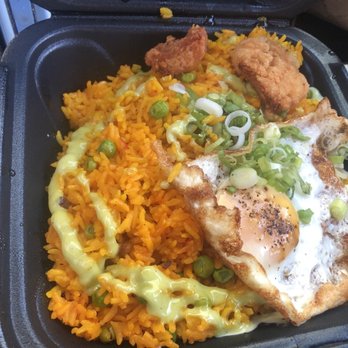 KOW Restaurant - The Arroz con Pollo dish came with two tiny pieces of fried chicken and even less grilled chicken. - Comfort Food Near Me - Miami, Florida KOW Restaurant - The Arroz con Pollo dish came with two tiny pieces of fried chicken and even less grilled chicken. - Comfort Food Near Me - Miami, Florida