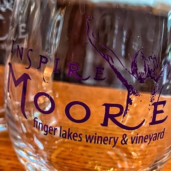 Inspire Moore Winery - a glass of wine on a table - Wineries Near Me - Naples, New York