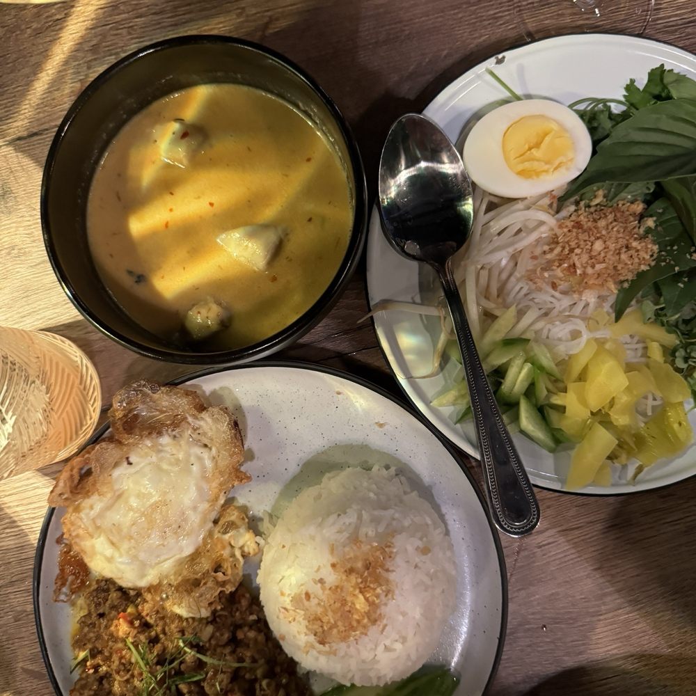 LeDu Thai - Kua kling: bottom left with the fried egg Gaeng Crabmeat turmeric with the hard boiled egg; - Thai Near Me - Phoenix, Arizona LeDu Thai - Kua kling: bottom left with the fried egg Gaeng Crabmeat turmeric with the hard boiled egg; - Thai Near Me - Phoenix, Arizona