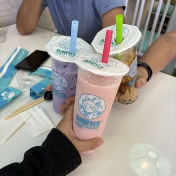 Miha’ Hotpot & Boba - a man holding two drinks - Bubble Tea Near Me - McAllen, Texas Miha’ Hotpot & Boba - a man holding two drinks - Bubble Tea Near Me - McAllen, Texas