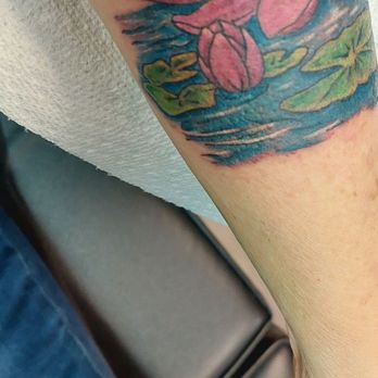 Hung‘s Tattoo Parlor - Pink lotus on water with a lillypad. - Tattoo Near Me - Saint Paul, Minnesota Hung‘s Tattoo Parlor - Pink lotus on water with a lillypad. - Tattoo Near Me - Saint Paul, Minnesota