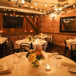 Lucca's Pizzeria & Ristorante - Lucca's private event room set for a gathering.