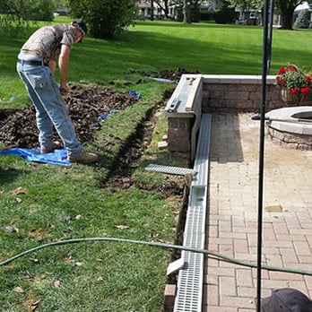 Quick Fix Waterproofing - a man working in the yard - Masonry/Concrete Near Me - Island Lake, Illinois Quick Fix Waterproofing - a man working in the yard - Masonry/Concrete Near Me - Island Lake, Illinois