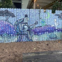The Green Turtle - Fence art on outside patio