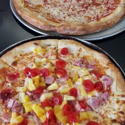 Vegan pizza on top and Hawaiian pizza on bottom. Vegan pizza on top and Hawaiian pizza on bottom.