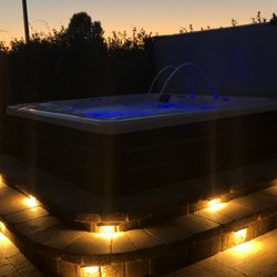Platinum Pavers - Our spa with the night lights around the steps.