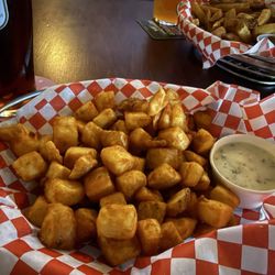 The Three Lions Pub - "Chips" baskets - mini and regular sized. Tarter and Curry sauces on the side.