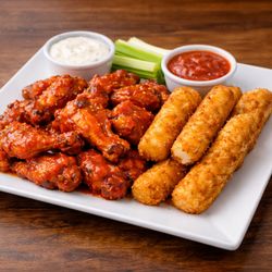 Scarlet 158 Restaurant - Buffalo wings and mozzarella sticks served with celery, ranch, and marinara. A perfect appetizer to share at Scarlet 158.