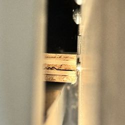 Winnebago Industries - Cracked panel when trying to stabilize the wobbly dinette.