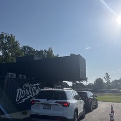 The Dark Side Coffee Company - This is the outside drive thru. This is Dark Side Coffee Company's third location to open up. It made of stacked shipping containers.