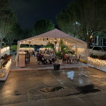 Fiorella - an outdoor restaurant with lights on - Italian Near Me - Lake Worth, Florida