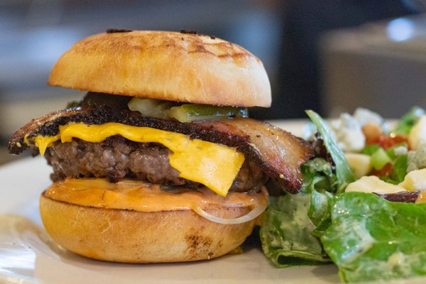 Photo of Netshed No. 9 - Gig Harbor, WA, US. DIVE-IN SPECIAL DELUXE BURGER. Netshed Nights. Dinner served Friday and Saturday nights through Labor Day. Waterfront dining.