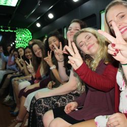 Signature Transportation Services - The new limo bus has leather wrap around bench seating for 26 passengers.